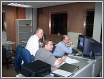 Jan (Mike) Hollis, Anthony Remijan, and Philip Jewell (left to right) in the GBT control room, 2004 (taken by Lovas).