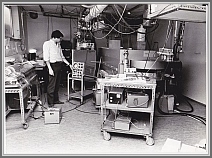Zeeman MW spectrometer with E.Hamer (1970).  The magnet pole distance could be changed by lifting the top pole with four hydraulic jacks and changing spacers.  The achievable magnetic field  was 21 kG for 6 cm pole spacing.  The detector end of a J-band sample cell is visible in the magnet. Measurements with this cell were made over the 5.3-40 GHz frequency region.